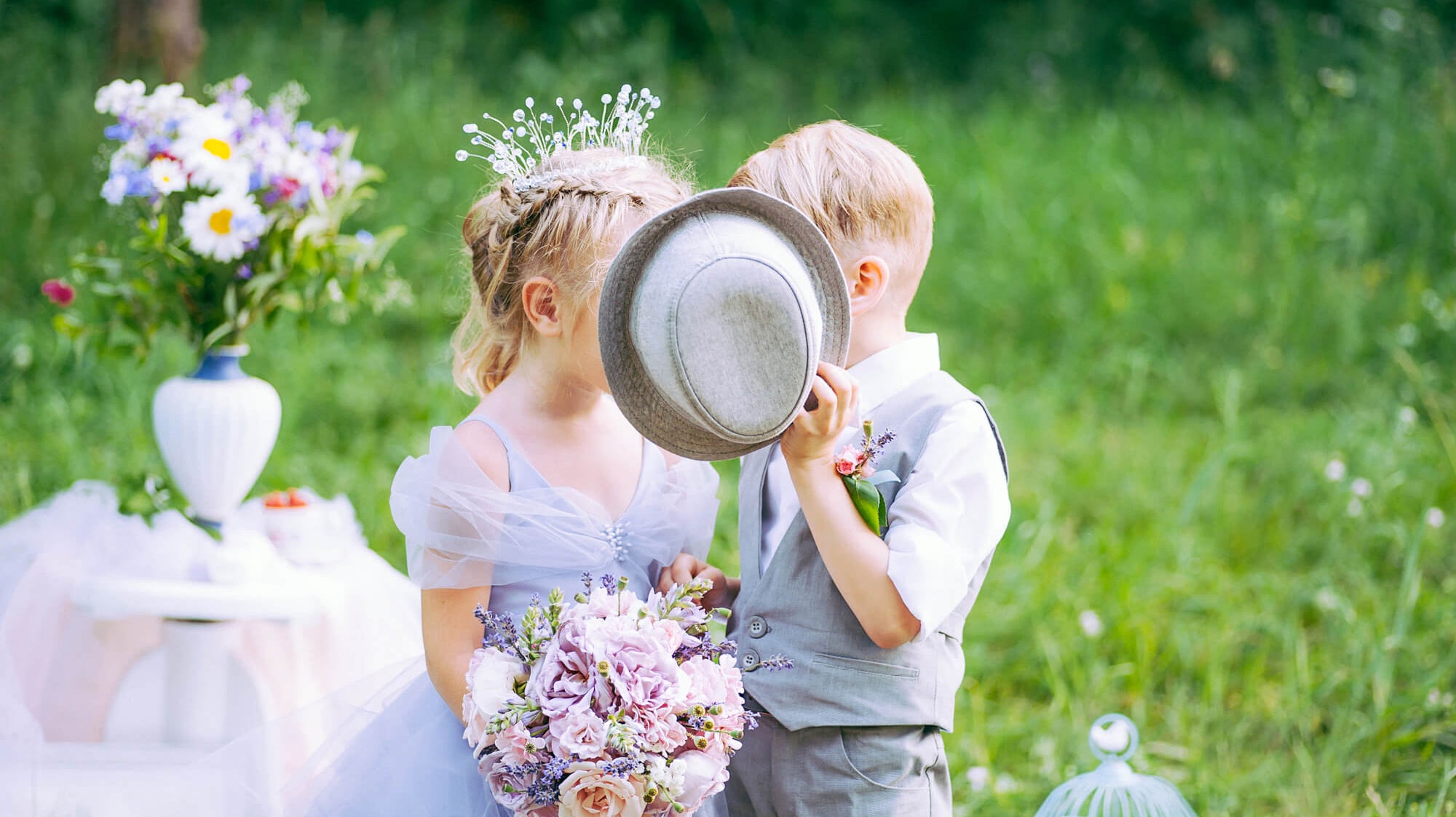 flower girl and ring bearer standing at wedding
