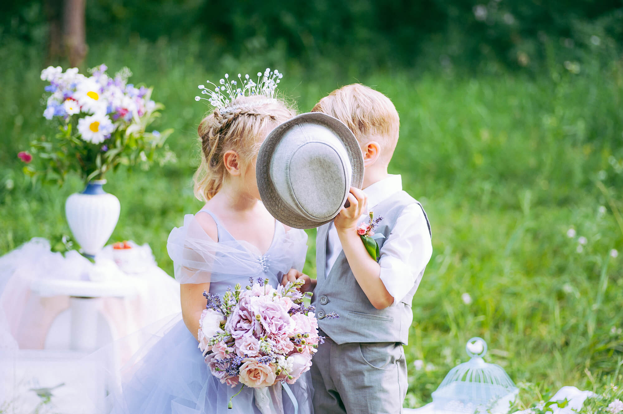 flower girl and ring bearer standing at wedding