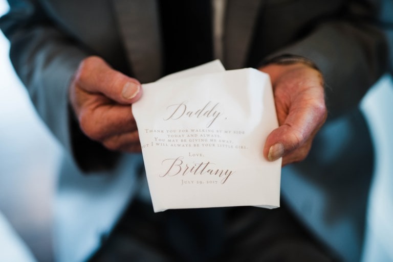 dad holding handkerchief from daughter