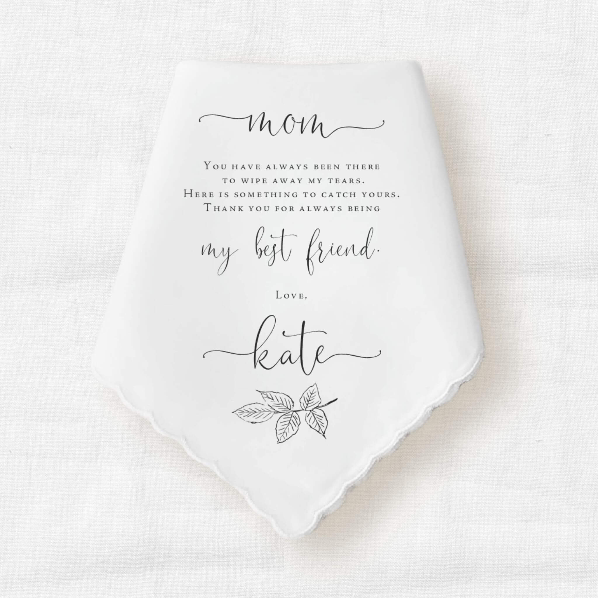 scallop edge handkerchief wedding keepsake to mom with black leaf graphic below a personalized message from the bride