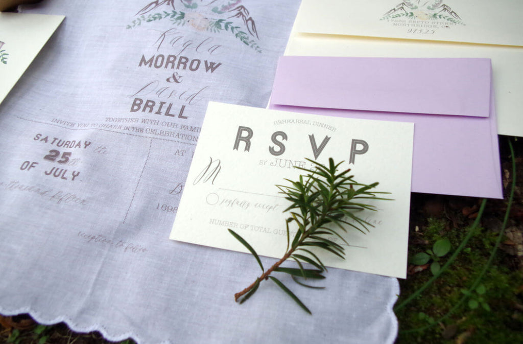wedding rsvp cardstock laying on top handkerchief invitation