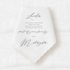 handkerchief with personalized message in black ink from the bride to the mother of the groom expressing the grateful joy to be part of the family