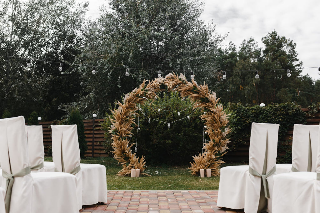 rustic wedding ceremony with white chairs